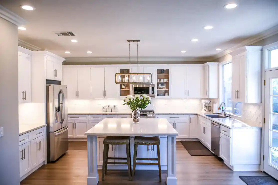 a kitchen with beautifully painted cabinets